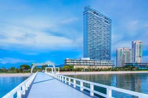 Modern high-rise waterfront residential building with pier