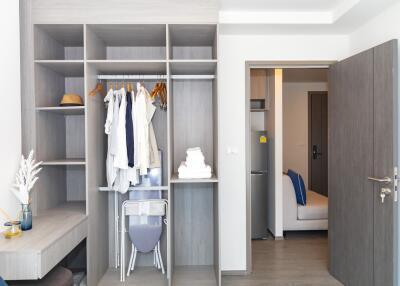 Modern bedroom with open wardrobe and stylish decor
