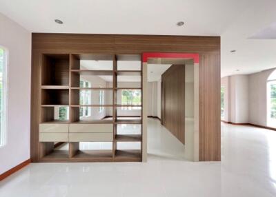 Spacious and modern living room with bright interiors and built-in shelves