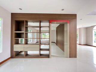 Spacious and modern living room with bright interiors and built-in shelves