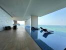 Luxurious indoor pool with ocean view in modern building