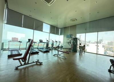 Spacious high-rise gym with panoramic city views