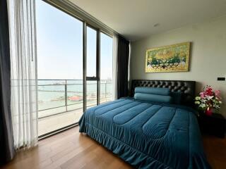 Modern bedroom with ocean view and elegant decor