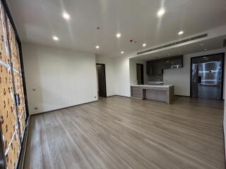 Spacious open plan living room with kitchen area