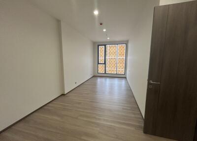 Spacious empty living room with large windows