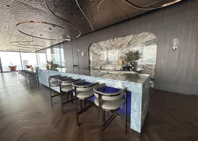 Modern kitchen with marble bar and stylish seating