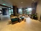 Spacious modern lobby with comfortable seating and lush greenery