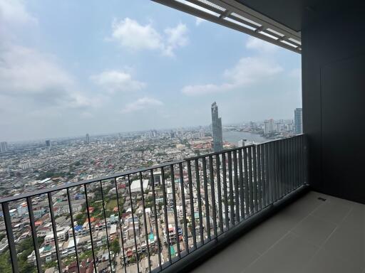High-rise apartment balcony overlooking expansive city view