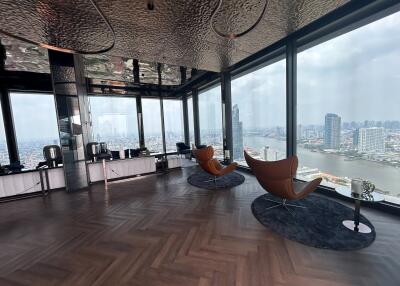 Luxurious high-rise living room with panoramic city and river views