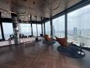 Luxurious high-rise living room with panoramic city and river views