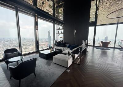 Spacious high-rise apartment living room with panoramic city views