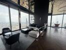 Spacious high-rise apartment living room with panoramic city views