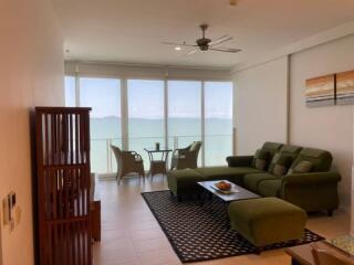 Spacious living room with ocean view and ample natural light