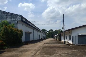 Exterior view of industrial warehouses with paved road