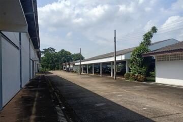 Spacious outdoor area of a commercial property with covered parking