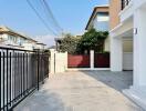 Modern residential home with gated entry and spacious forecourt