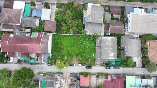 Aerial view of a residential neighborhood showcasing various housing layouts and green spaces