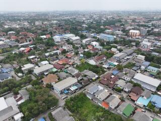 Aerial view of a residential area showing various houses and buildings