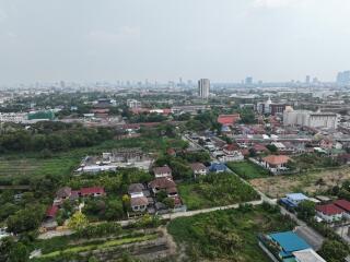 Aerial view of a residential area showing mixed housing and green spaces