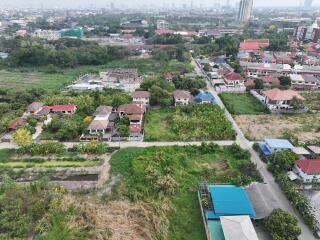 Aerial view of a residential area with diverse housing and green spaces