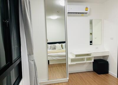 Modern bedroom with mirror wardrobe and minimalistic decor