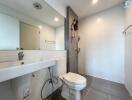 Modern bathroom with wall-mounted sink and shower