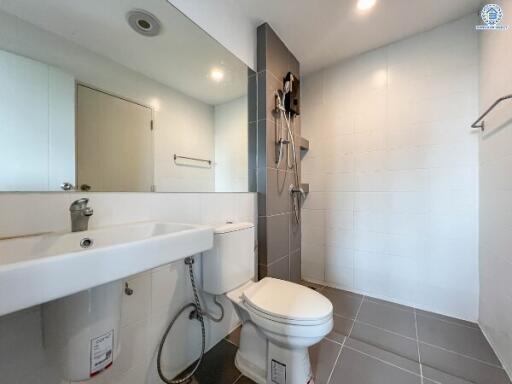 Modern bathroom with wall-mounted sink and shower