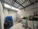 Spacious garage with storage and utility area