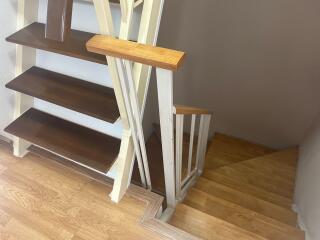 Wooden staircase with white railings in a modern home