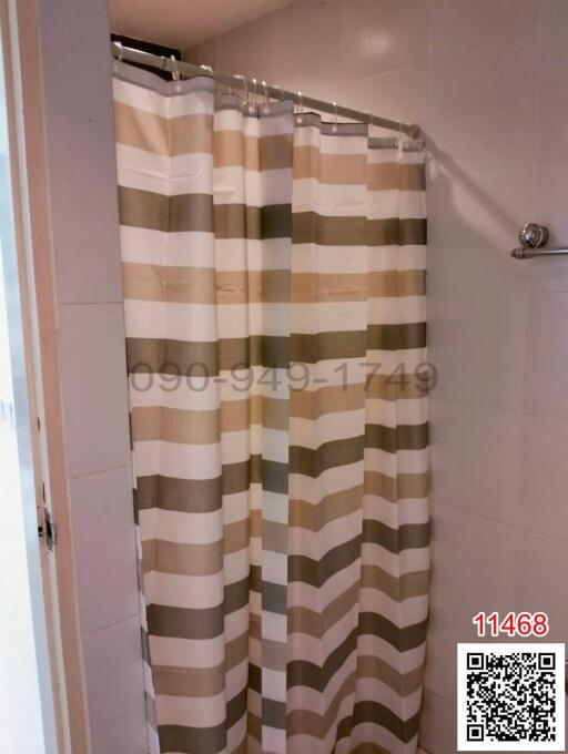 modern bathroom with striped shower curtain