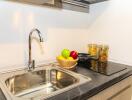 Modern kitchen with stainless steel sink and granite countertop