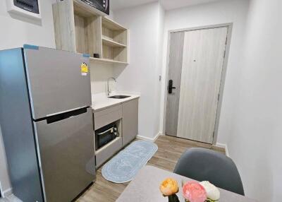 Modern compact kitchen with integrated appliances