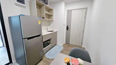 Modern compact kitchen with integrated appliances