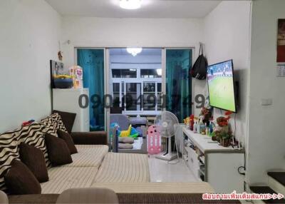 Spacious and well-lit living room with modern amenities and balcony access