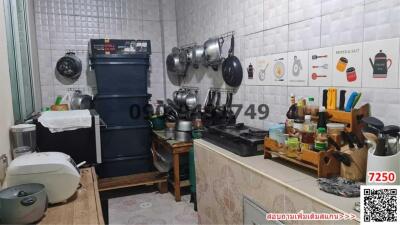 Small and Cluttered Kitchen with Various Cooking Items