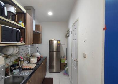 Long narrow kitchen with modern appliances and ample storage space