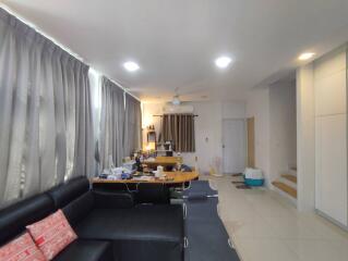 Spacious and well-lit living room with modern amenities