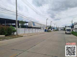 Street view of a suburban area with industrial buildings