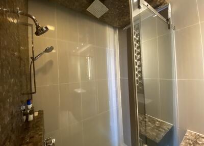 Modern bathroom with spacious glass shower enclosure