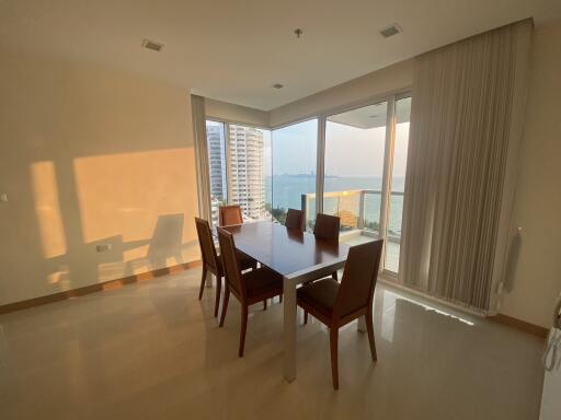 Spacious dining room with large windows and sea view