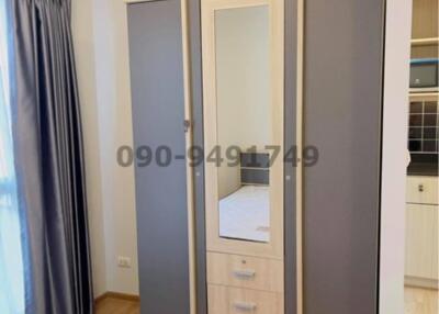 Spacious bedroom with built-in wardrobe and ample natural light