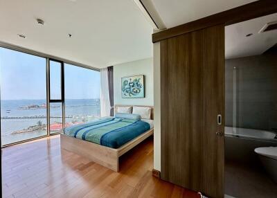 Ocean view bedroom with large window and modern design