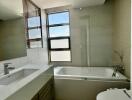 Bright and modern bathroom with large windows
