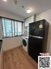 Modern kitchen with black appliances and bright interior