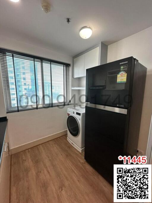 Modern kitchen with black appliances and bright interior