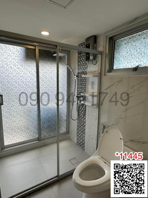 Modern bathroom with shower stall and toilet