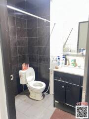 Modern bathroom interior with dark tiles