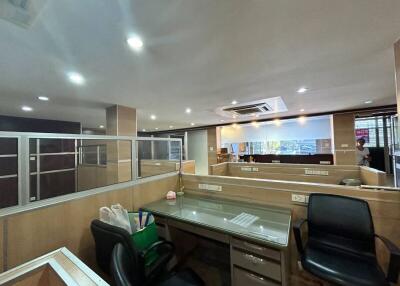 Modern office interior with cubicles and bright lighting