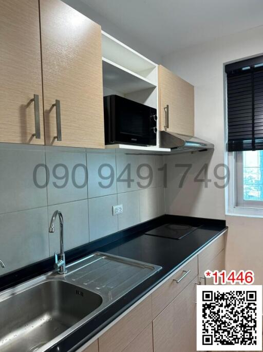 Modern kitchen with wooden cabinets and stainless-steel sink