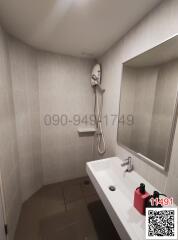 Modern bathroom with bathtub and wall-mounted shower